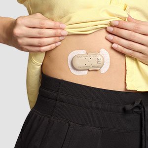Cequr Simplicity showing on the stomach of a patient illustrating it's convenient